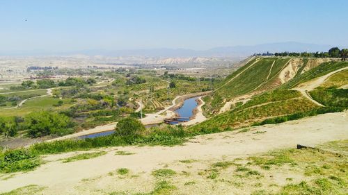 Scenic view of landscape against cloudy sky