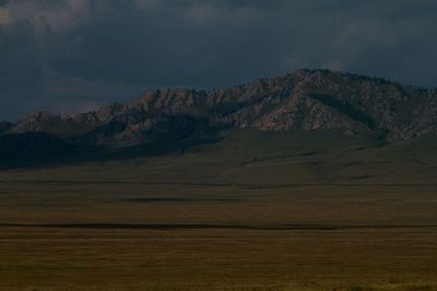 Scenic view of landscape and mountains against sky