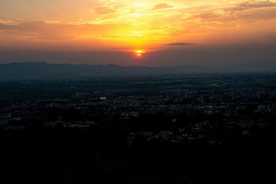 Aerial view of city during sunset