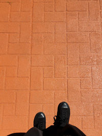 Low section of man standing on floor