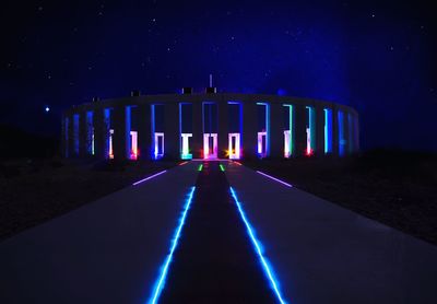 Illuminated bridge at night