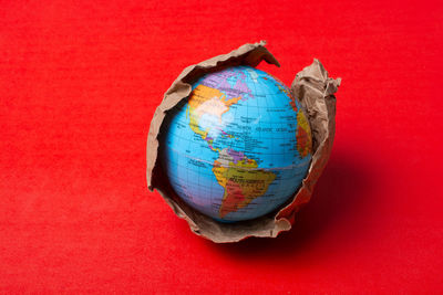 High angle view of painting on red background