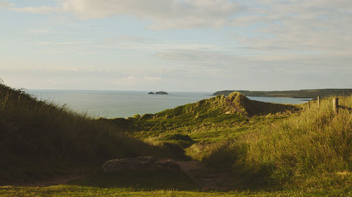 Scenic view of lighthouse and sea against sky