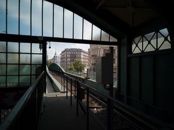 Bridge in city seen through glass window