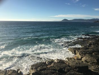 Scenic view of sea against cloudy sky