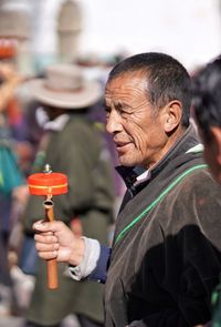 Portrait of man holding camera