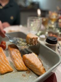 Cropped hand of person preparing food