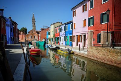 View of boats moored in canal