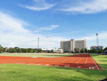 View of soccer field against cloudy sky