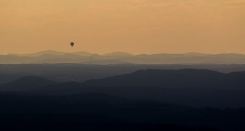 Scenic view of mountains at sunset