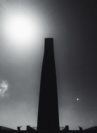 Low angle view of building against cloudy sky