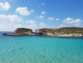 Scenic view of blue-green sea against sky