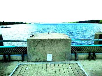 Empty jetty leading to calm sea