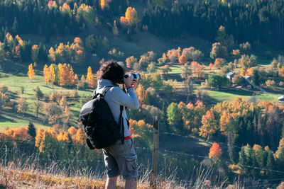 Man photographing at camera