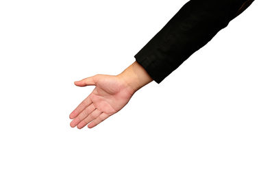 Close-up of person hand against black background