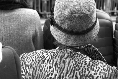 Rear view of man sitting in bus