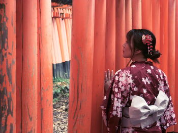 Rear view of woman standing outdoors