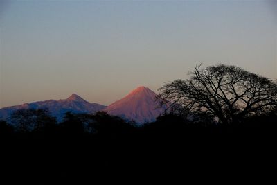 Scenic view of silhouette mountains against clear sky