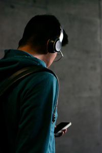 Unrecognizable person is watching his smartphone