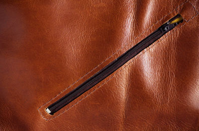 Full frame shot of brown leather with zipper
