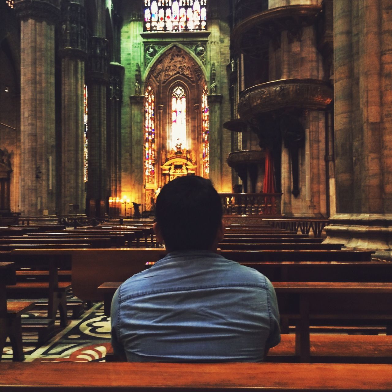 architecture, religion, built structure, place of worship, spirituality, building exterior, rear view, church, illuminated, men, arch, travel destinations, temple - building, lifestyles, famous place, person