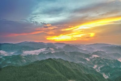 Scenic view of mountains against sky during sunset