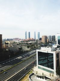 High angle view of city buildings against sky