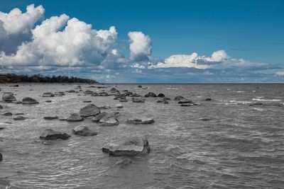 Scenic view of sea against cloudy sky