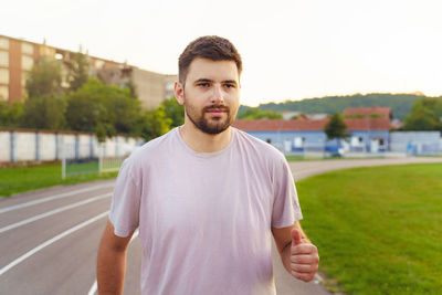 Portrait of young man standing outdoors