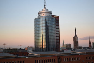 View of cityscape against sky during sunset