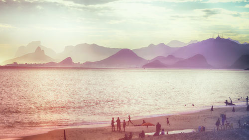 View of beach against cloudy sky