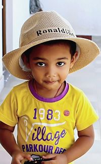 Portrait of cute boy wearing hat