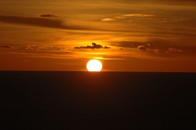 Scenic view of sea against romantic sky at sunset