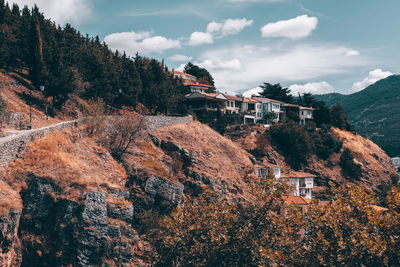 Panoramic view of trees and mountains against sky