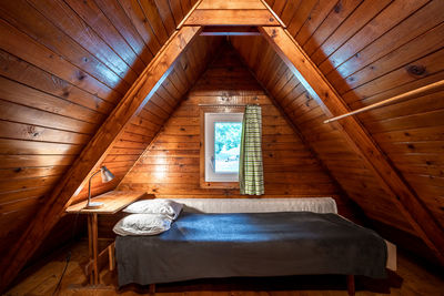 Interior of bedroom in wooden house