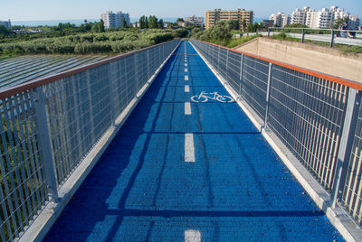 High angle view of walkway amidst buildings in city