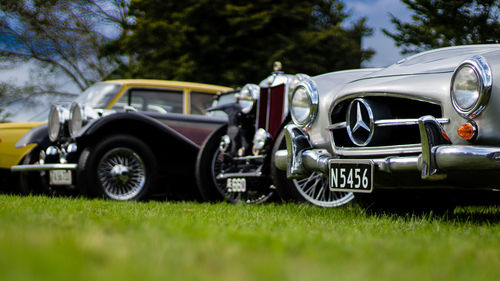 Close-up of vintage car on field