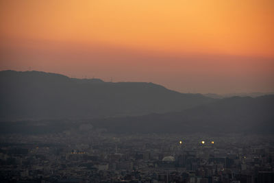 High angle view of townscape against sky during sunset