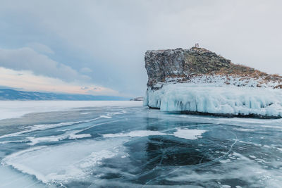 Scenic view of frozen lake against sky