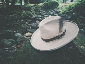 High angle view of hat on rock