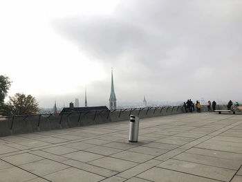 Panoramic view of people on street against sky