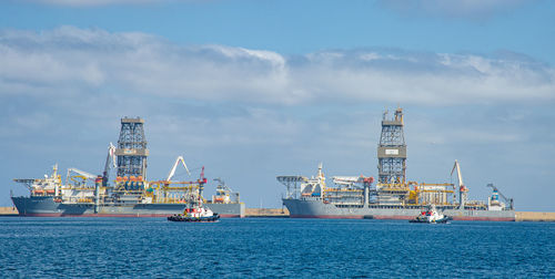 Picture of las palmas canary island port with large ships carrying cargo, large container cranes