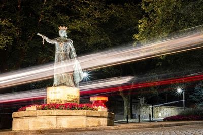 Light trails on fountain at night