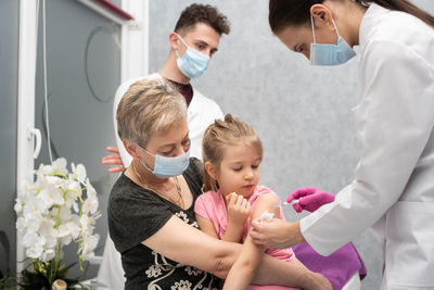 Doctor examining patient in hospital