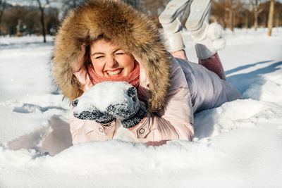 Woman wearing hat in snow