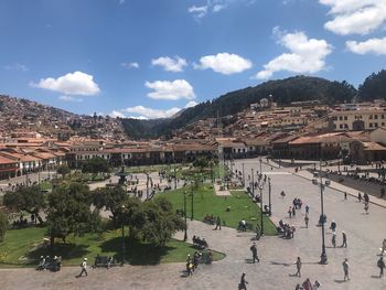 High angle view of people in town against sky