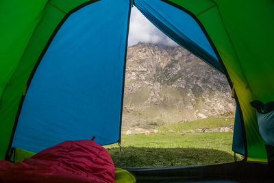 View of tent against sky seen through car window