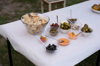 Close up of food on table with bread and dips