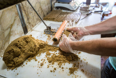 High angle view of man preparing food on table