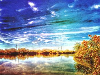 Scenic view of lake against cloudy sky